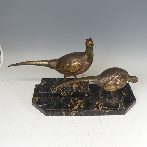 283 - An Art Deco gilt bronze Centrepiece modelled as a pair of Pheasants, signed 'I Gallo', on a stepped ... 