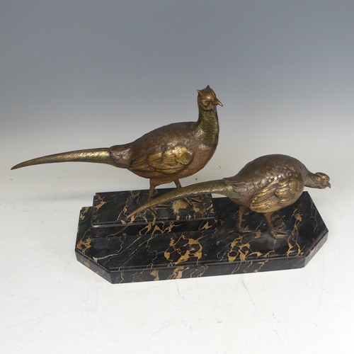 283 - An Art Deco gilt bronze Centrepiece modelled as a pair of Pheasants, signed 'I Gallo', on a stepped ... 