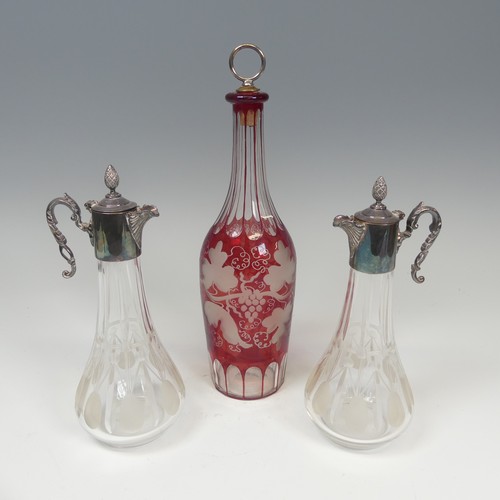 131 - A good cut and etched Ruby Flash glass Decanter, H 30 cm, together with two other etched glass and m... 