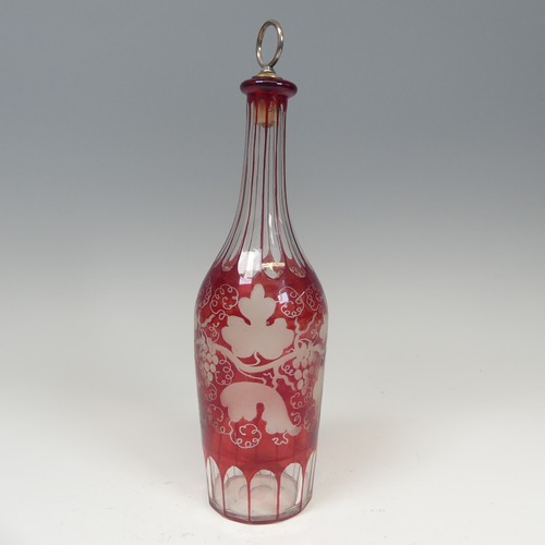 131 - A good cut and etched Ruby Flash glass Decanter, H 30 cm, together with two other etched glass and m... 