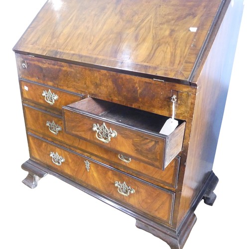 351 - A small Georgian mahogany Bureau, sloped fall front concealing fitted interior with ; pigeon holes, ... 