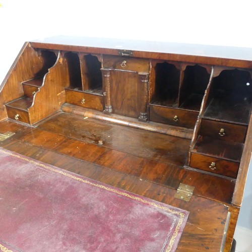 351 - A small Georgian mahogany Bureau, sloped fall front concealing fitted interior with ; pigeon holes, ... 