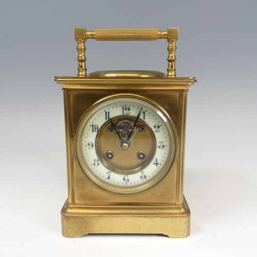 301 - A large French brass carriage Clock, the dial centre inset with the visible lever escapement and ena... 