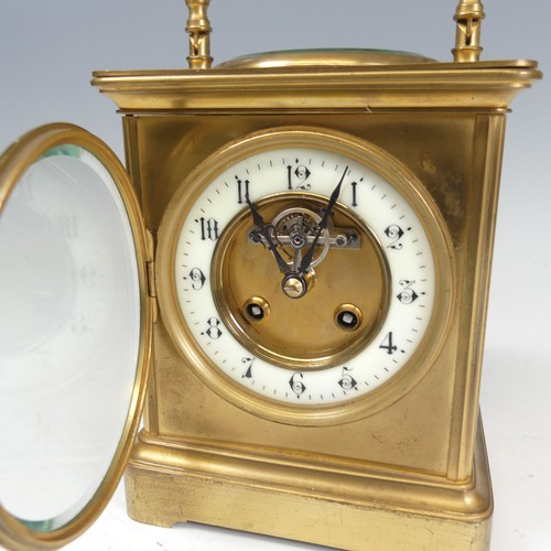 301 - A large French brass carriage Clock, the dial centre inset with the visible lever escapement and ena... 