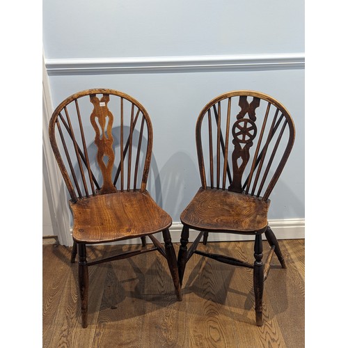 359 - A harlequin set of seven antique spindle wheelback elm windsor Chairs, with moulded saddle seats rai... 