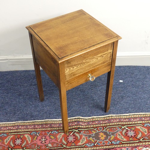 515 - An antique oak hinged top work Table, of a small size, W 38 cm x H 61 cm x D 38 cm.