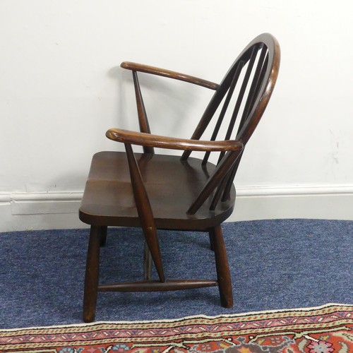 520 - A small dark Ercol Child's chair, W 61 cm x H 70 cm x D 40 cm.