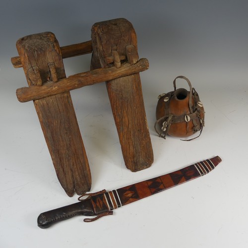 523 - An antique tribal wooden camel Saddle, W 34 cm x H 35 cm x D 46 cm, together with a West African Mac... 