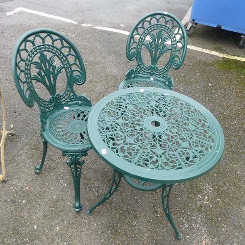 653 - A green-painted cast metal circular garden Table and two Chairs, with pierced design, (Table) W 61 c... 