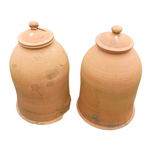 655 - A pair of weathered terracotta Rhubarb Forcers with covers, one with damaged cover and base, H 60 cm... 