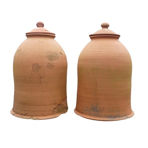 655 - A pair of weathered terracotta Rhubarb Forcers with covers, one with damaged cover and base, H 60 cm... 