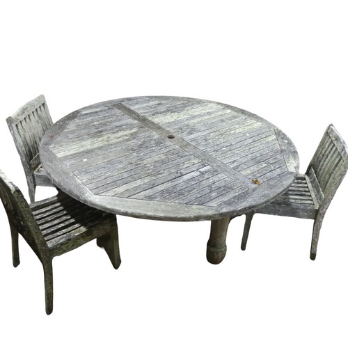 656 - A contemporary weathered plantation teak garden Suite by Lindsey, comprising of a very large circula... 