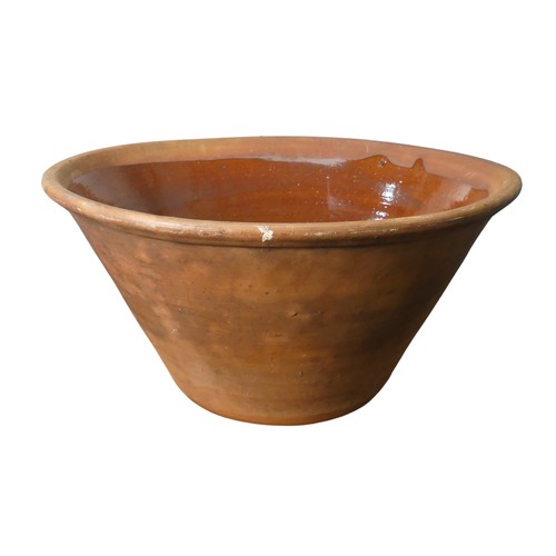 135 - A large 19th century terracotta pottery Mixing Bowl, with glazed interior, D 45cm x H 22cm.... 