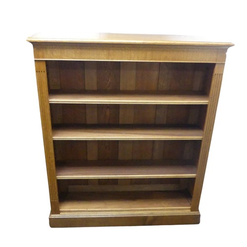 362 - An Edwardian light oak open Bookcase, with four adjustable shelves flanked by pilasters on plinth ba... 