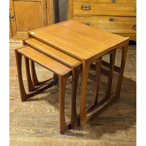 317 - A nest of three retro teak Tables, W 53 cm x H 49 cm x D 43 cm.