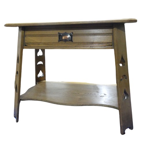 336 - An Arts and Crafts side blond oak side Table, moulded square top above chamfered central drawer and ... 