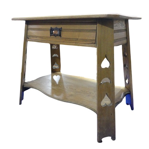 336 - An Arts and Crafts side blond oak side Table, moulded square top above chamfered central drawer and ... 