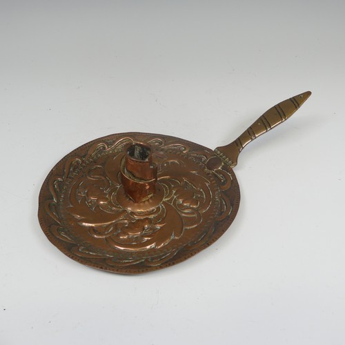 340 - John Pearson, an Arts and Crafts copper Chamber stick, repoussé decorated with stylised foliage on a... 