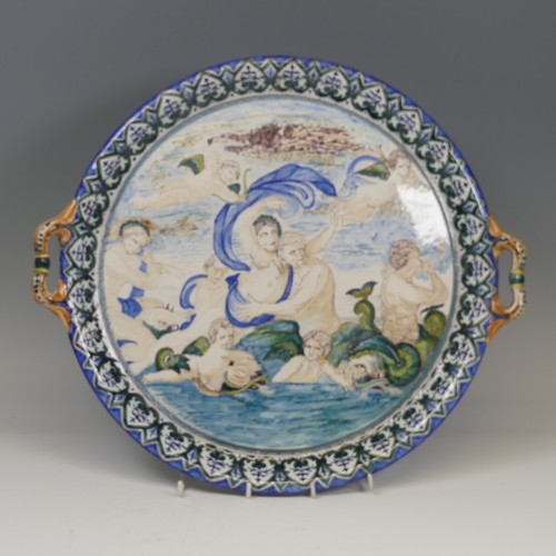 137 - A Continental majolica two-handled Charger/Tray, with a similar jug, both decorated in the style of ... 