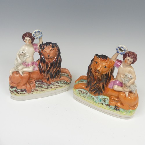 142 - A matched pair of 19thC Staffordshire pottery figural Bookends, modelled as a recumbent lion with a ... 