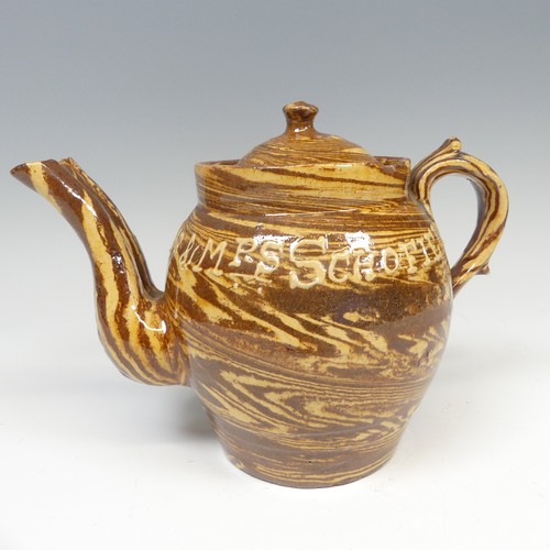 143 - A late 19thC slipware marriage Teapot, with double spout and cover, chips to rim, inscribed for 'Mr ... 