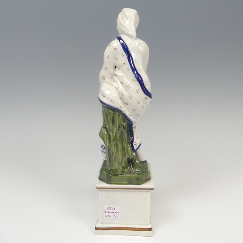 152 - An early 19thC pearlware figure of Asclepius, possibly Ralph Wood, decorated in typical pratt ware p... 