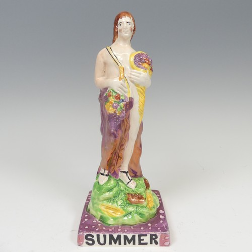 157 - A 19thC lustre ware figure of Summer, possibly Dixon, Austin and Co, modelled with cornucopia nested... 