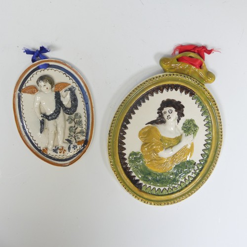 161 - A 19thC pearlware wall hanging Plaque, ovular in shape, depicting a moulded relief of a woman at the... 