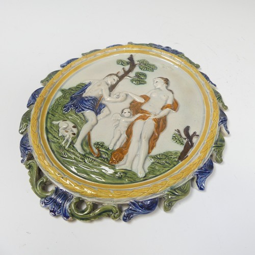 163 - An early 19thC pratt ware wall Plaque, depicting Paris and Aphrodite, decorated in typical colour pa... 