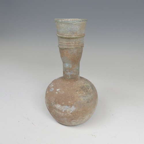 177 - A Roman iridescent glass Flask, c. 2-3 century AD, of bulbous body with tapering ribbon trailed neck... 