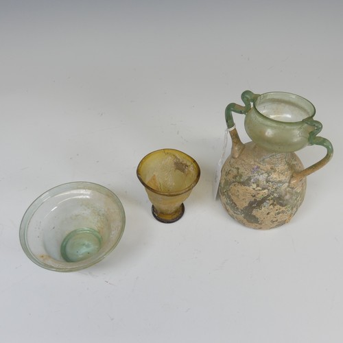 178 - A Roman green glass twin-handled Flask, of bulbous form, H 14.5cm, together with a Roman glass Bowl ... 