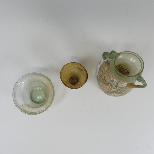 178 - A Roman green glass twin-handled Flask, of bulbous form, H 14.5cm, together with a Roman glass Bowl ... 