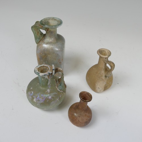 180 - A Roman iridescent glass Flask, with handle connecting neck with spherical body, H 7cm, together wit... 