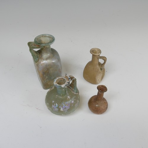 180 - A Roman iridescent glass Flask, with handle connecting neck with spherical body, H 7cm, together wit... 