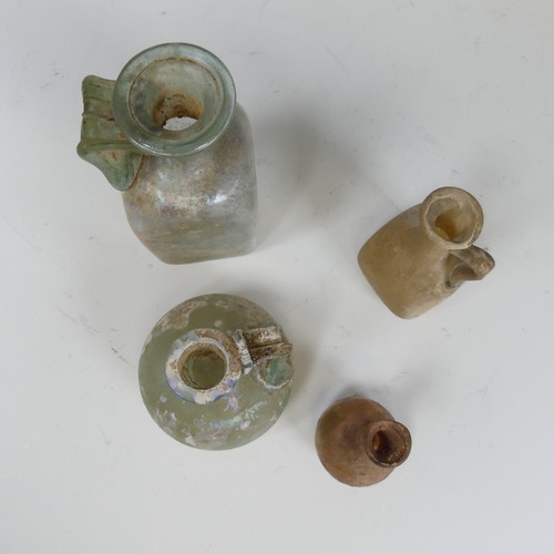 180 - A Roman iridescent glass Flask, with handle connecting neck with spherical body, H 7cm, together wit... 