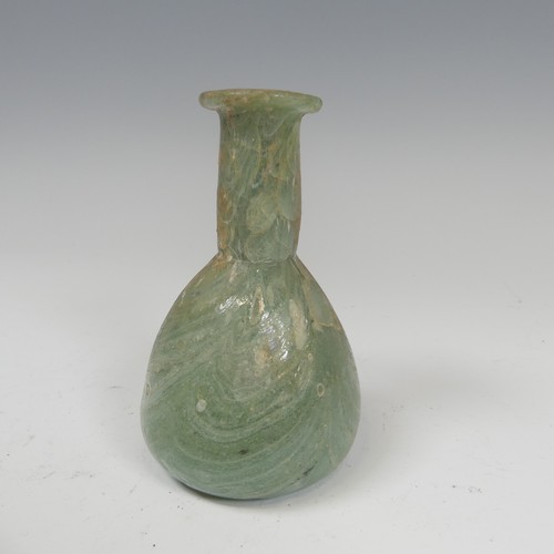 190 - A Roman marbled glass toilet bottle c. 1st century AD, green with white striations and of pear shape... 