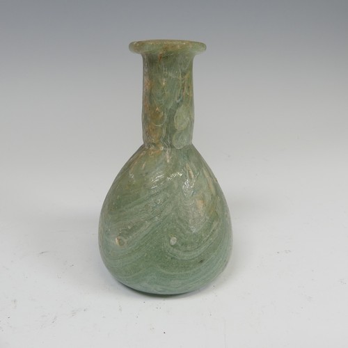 190 - A Roman marbled glass toilet bottle c. 1st century AD, green with white striations and of pear shape... 