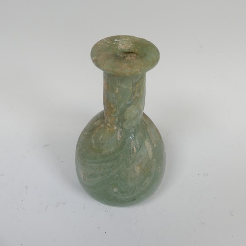 190 - A Roman marbled glass toilet bottle c. 1st century AD, green with white striations and of pear shape... 