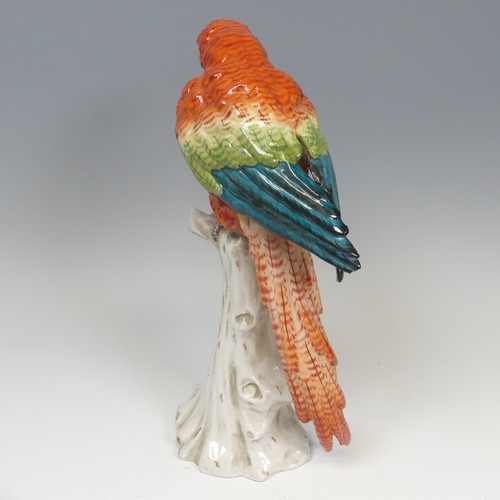 195 - A 19thC Continental porcelain figure of a Parrot, possibly a Macaw, the hard paste porcelain painted... 