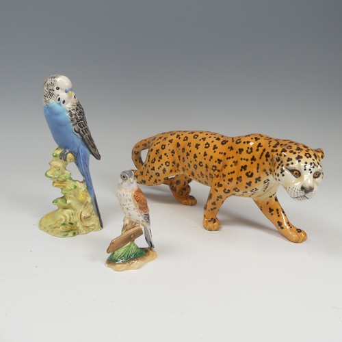 197 - A Beswick figure of a Budgie, number 1216, perched on branch, facotry marks to base, together with a... 