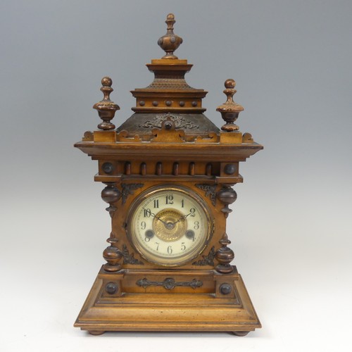 310 - A late 19th century continental walnut Mantel Clock, movement marked with crossed arrows and label '... 