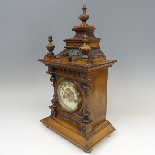 310 - A late 19th century continental walnut Mantel Clock, movement marked with crossed arrows and label '... 