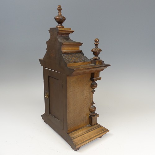 310 - A late 19th century continental walnut Mantel Clock, movement marked with crossed arrows and label '... 