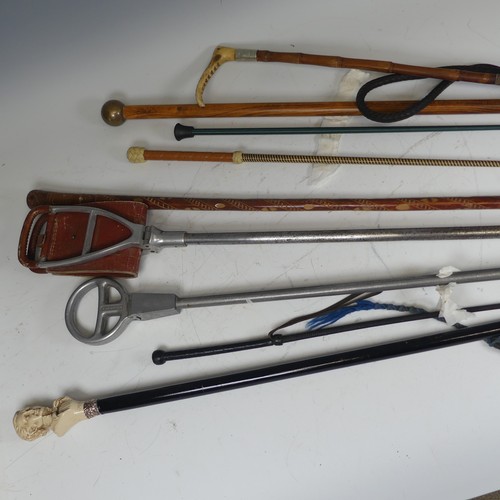 331 - A Swaine & Adeney riding Crop, together with a small quantity of walking sticks, shooting sticks... 