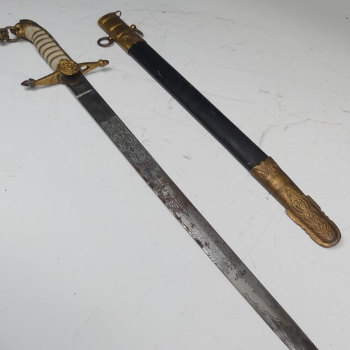 4 - A reproduction George VI British naval inspired officers Dirk and scabbard, lion head pommel, the ja... 