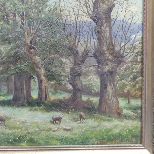 237 - Fred E. Robertson (1878-1953), Sheep in a meadow with trees, oil on canvas, signed lower right, 46cm... 