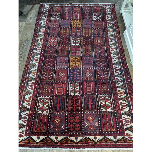 650 - Tribal rugs; a good Persian Hamadan red-ground carpet, wool pile on cotton base, 266cm x 173cm, good... 