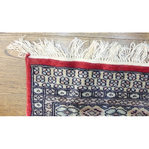 641 - Tribal Rugs; a finely knotted red ground Persian rug, wool pile on cotton base, 280cm x 176cm, pile ... 