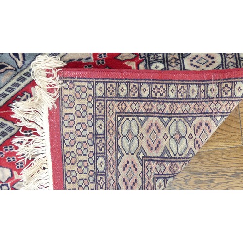 641 - Tribal Rugs; a finely knotted red ground Persian rug, wool pile on cotton base, 280cm x 176cm, pile ... 