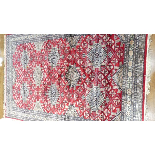 641 - Tribal Rugs; a finely knotted red ground Persian rug, wool pile on cotton base, 280cm x 176cm, pile ... 